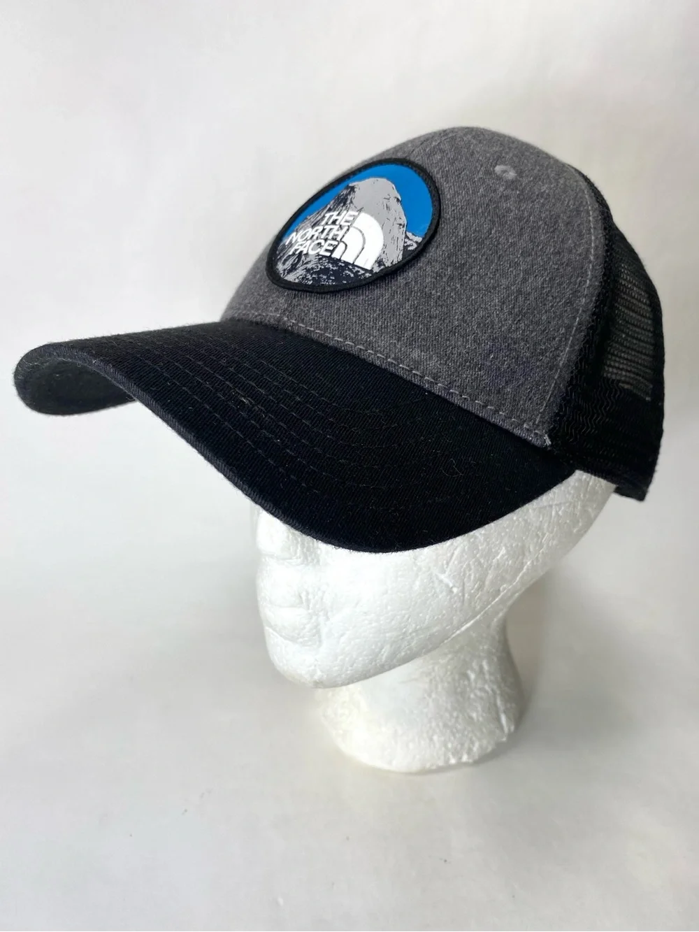The North Face Grey & Black Patch Trucker Hat with Blue Accent Snap Back Unisex
